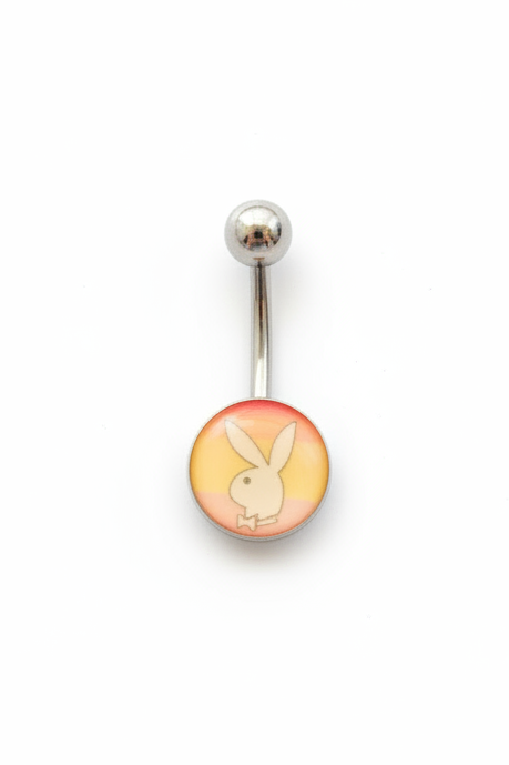 Rainbow Bunny Belly Button Ring in 316l stainless steel on a white background in close up detail.