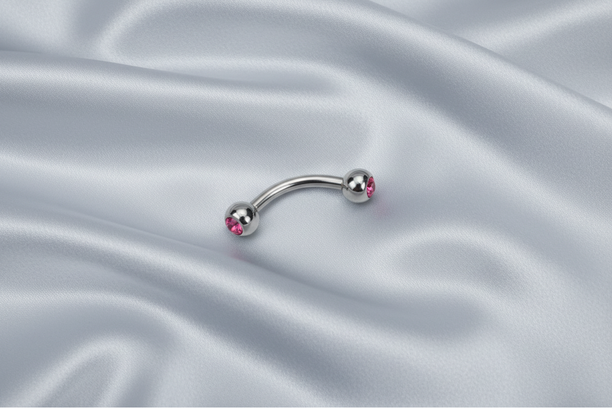 Pink Crystal Eyebrow Ring in 316l stainless steel.