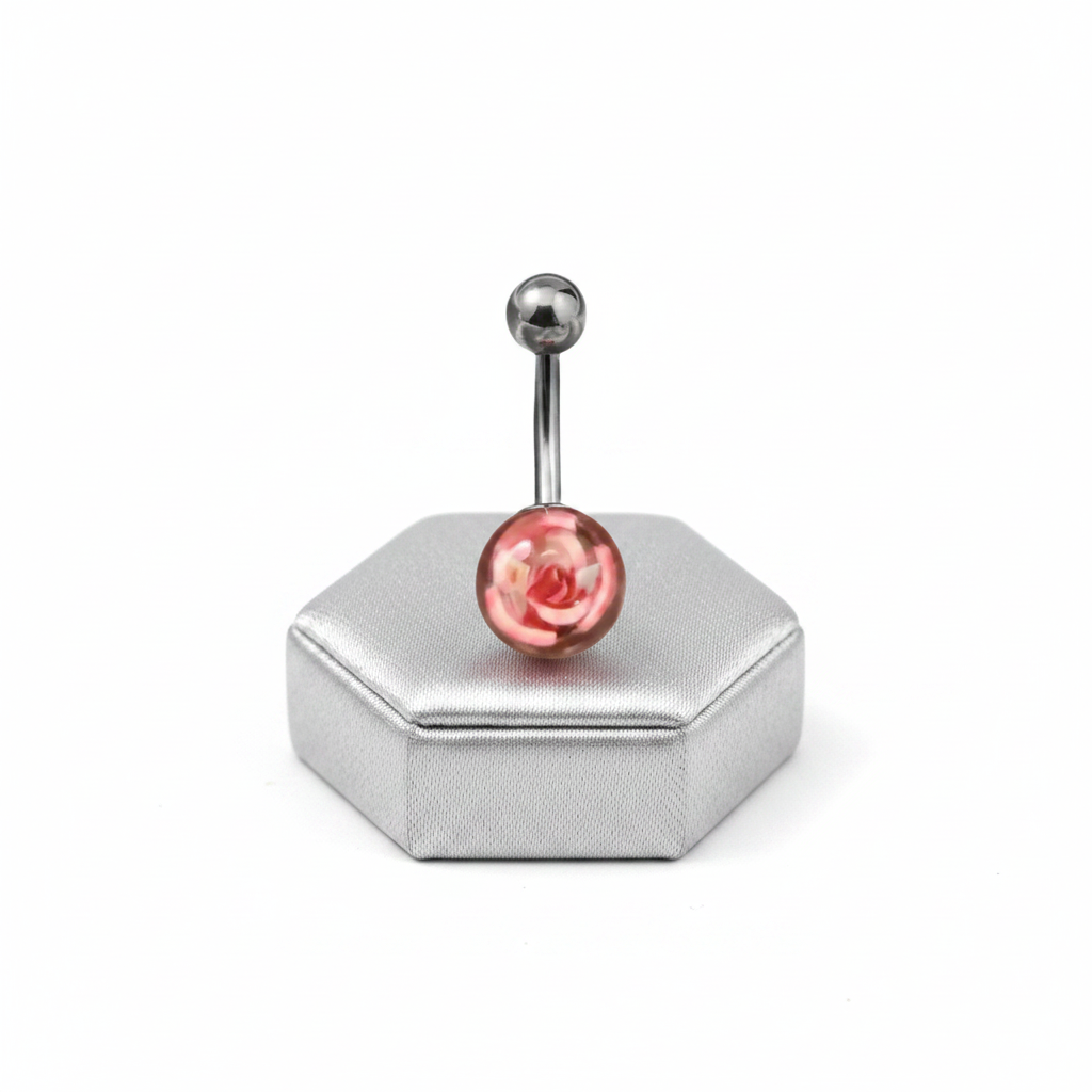 Pink Rose Acrylic Belly Button Ring in 316l stainless steel on a silver jewelry display upright position.