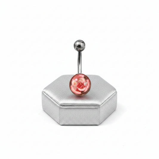 Pink Rose Acrylic Belly Button Ring in 316l stainless steel on a silver jewelry display upright position.