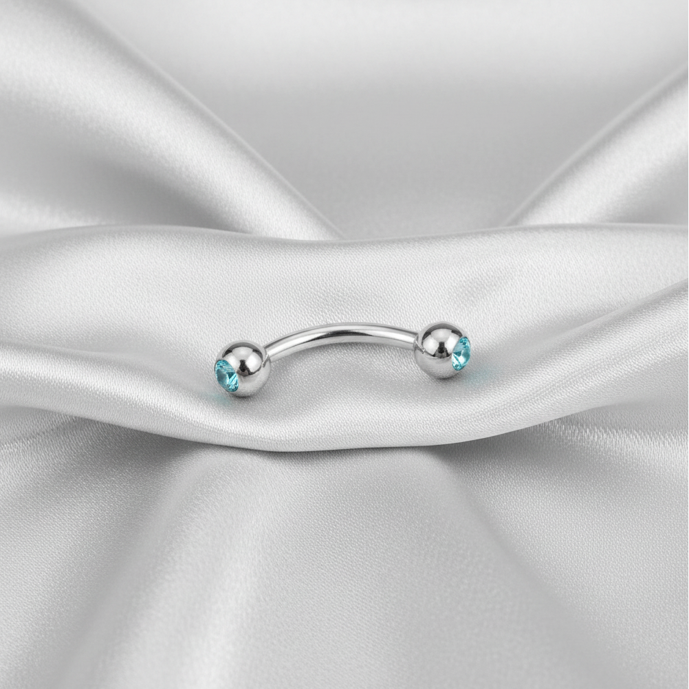 Aqua Crystal Eyebrow Ring in 316l stainless steel.