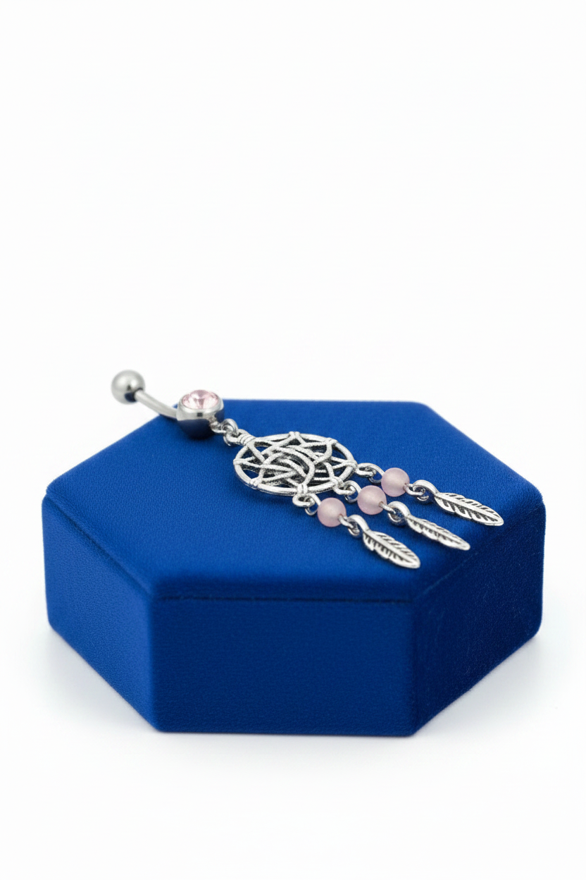 Pink Crystal Dream Catcher Belly Button Ring in 316l stainless steel on a blue velvet jewelry display.