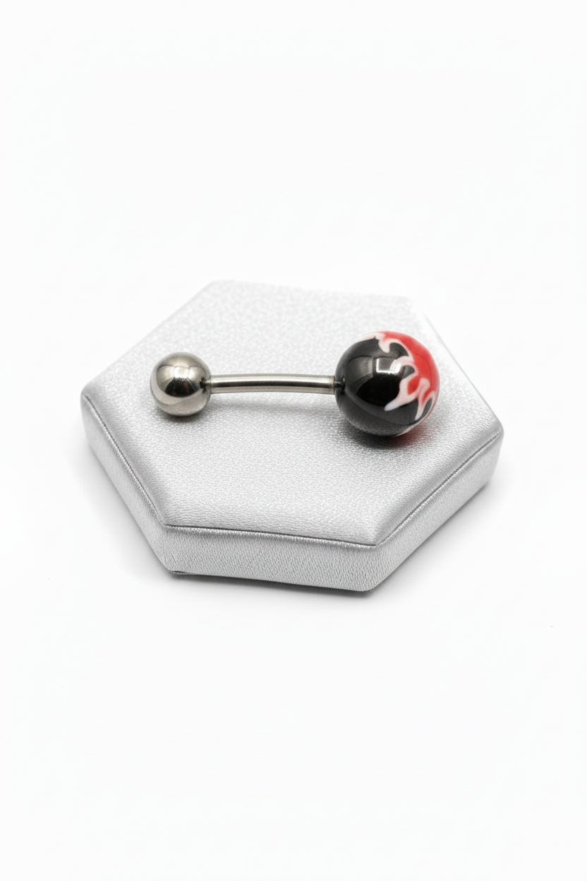 Red Fireball Acrylic Belly Button Ring in 316l stainless steel on a silver jewelry display horizontal angle.