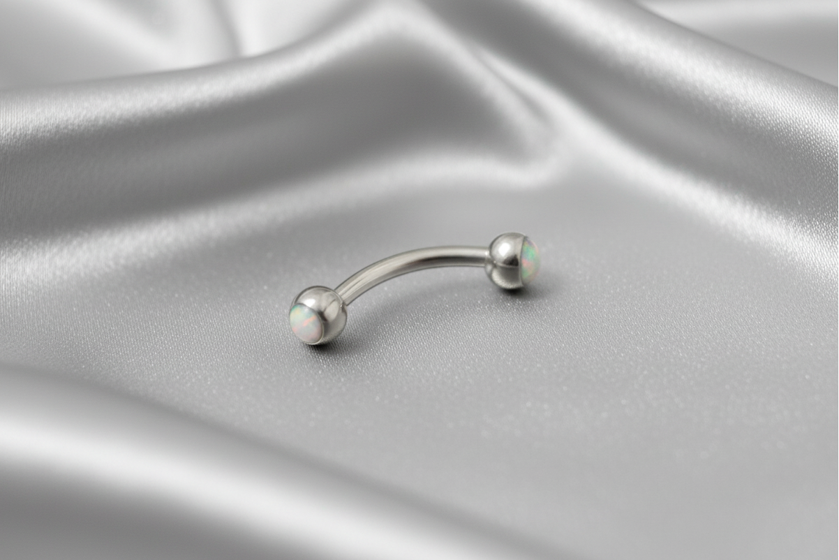 White Opal Eyebrow Ring in 316l stainless steel.