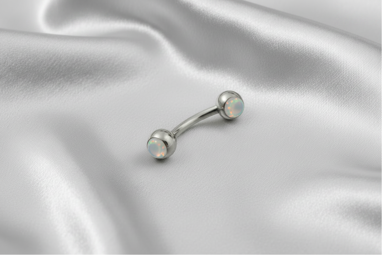 White Opal Steel Eyebrow Ring in 316l stainless steel.