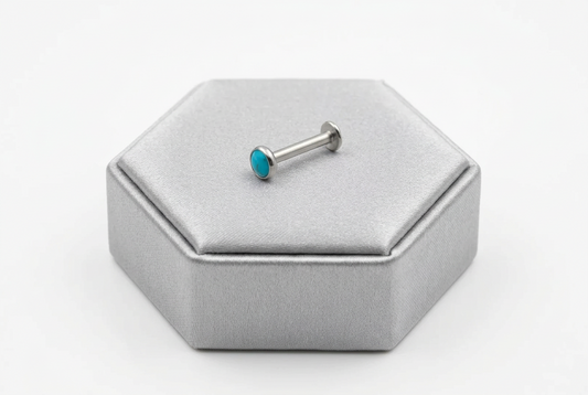 Aqua Opal Crystal Labret Lip Ring in 316l stainless steel on a silver silk jewelry display.