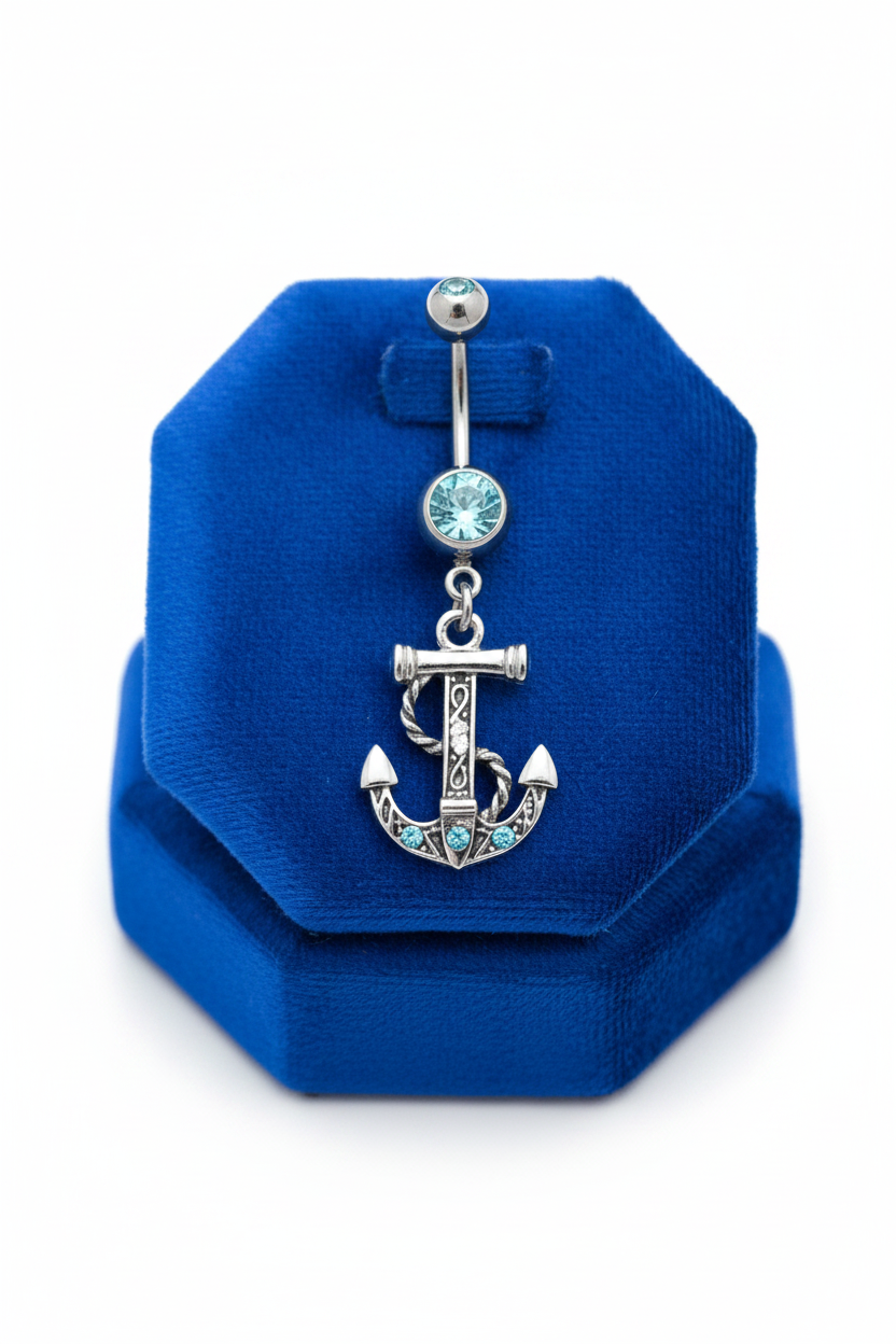 Aqua Crystal Anchor Belly Button Ring in 316l stainless steel on a blue velvet jewelry display.