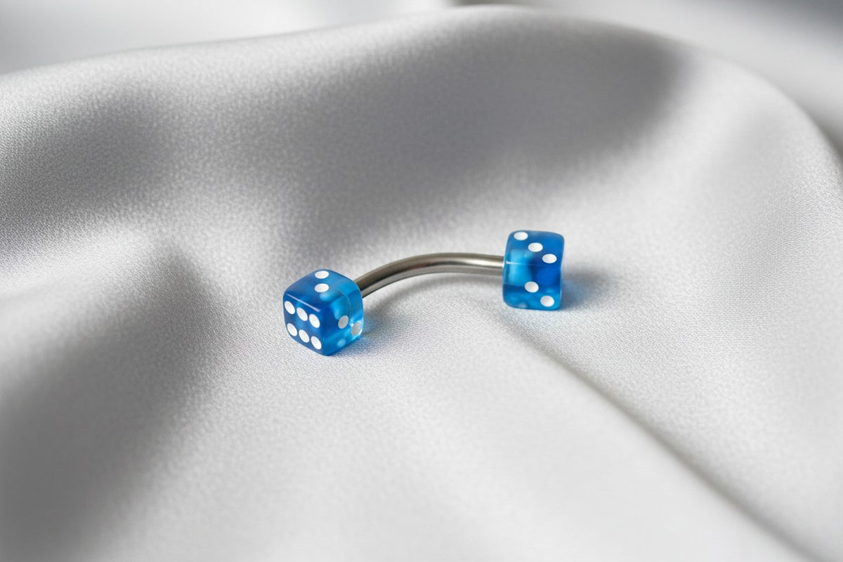 Blue Acrylic Dice Eyebrow Ring in 316l stainless steel.