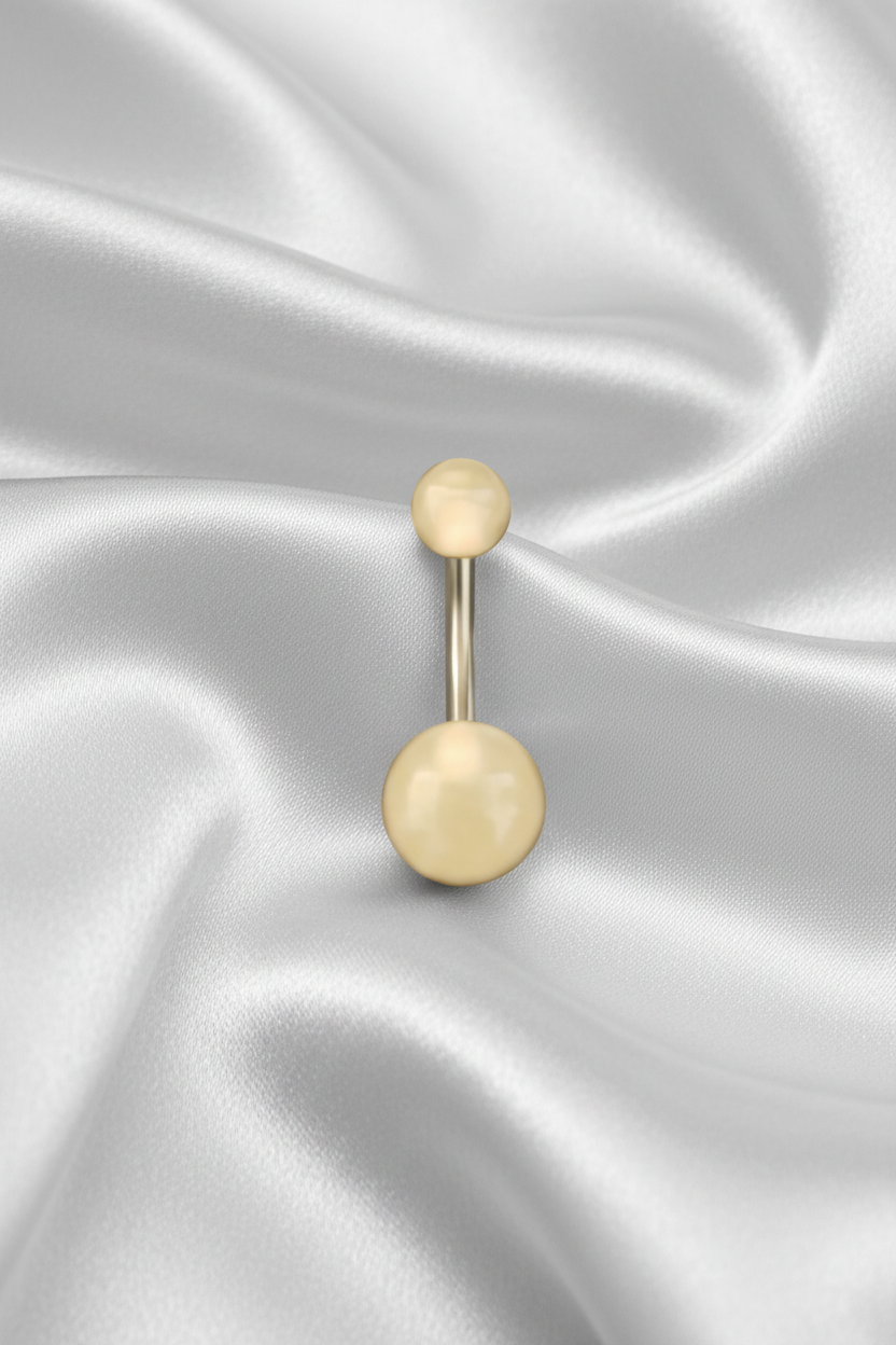 Peach Glow Acrylic Belly Button Ring in 316l stainless steel on silver silk fabric.