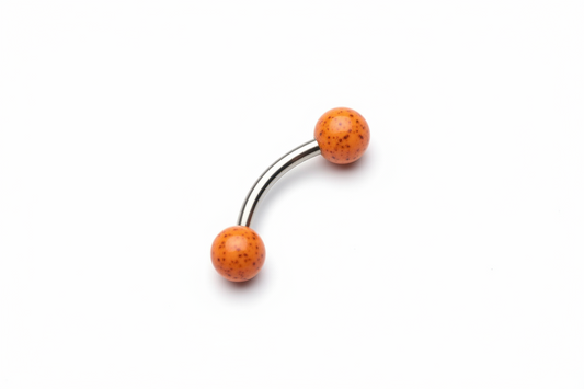 Orange Black Speckled Acrylic Eyebrow Ring in 316l stainless steel close up detail.