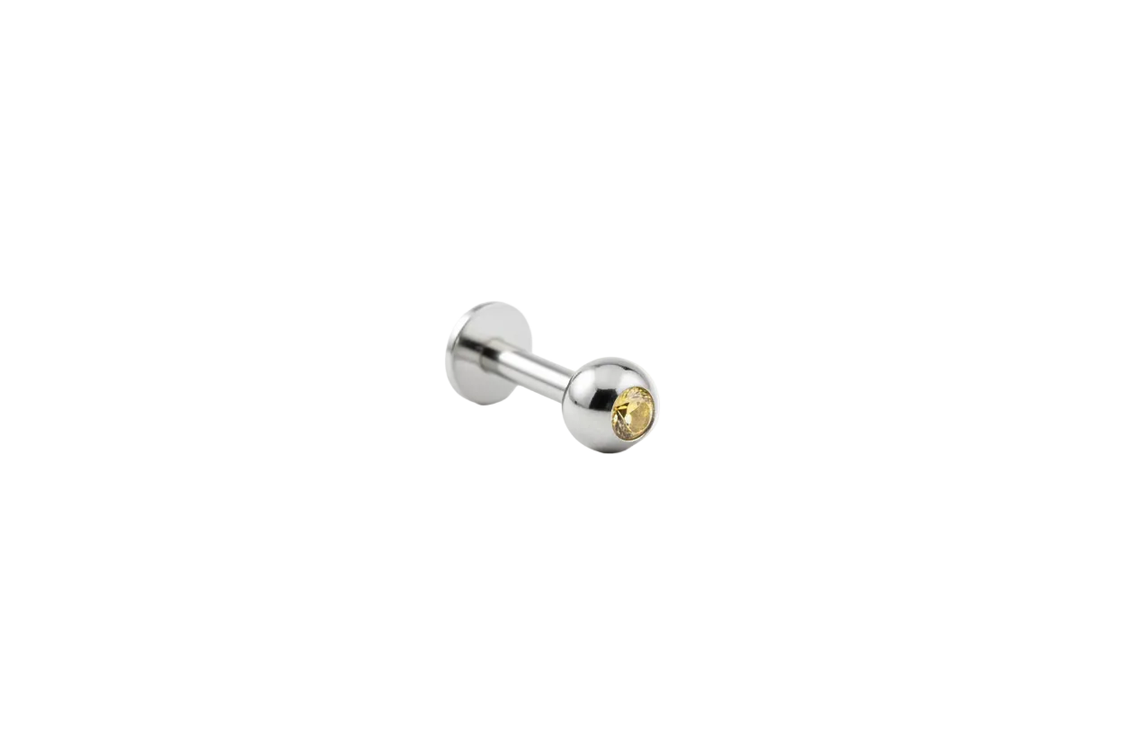 Yellow Crystal Labret Lip Ring - 316L Stainless Steel angled view.