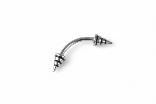 Black Striped Steel Spike Eyebrow Ring in 316l stainless steel close up detail.