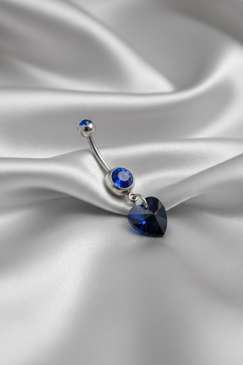 Blue Crystal Heart Belly Button Ring in 316l stainless steel.