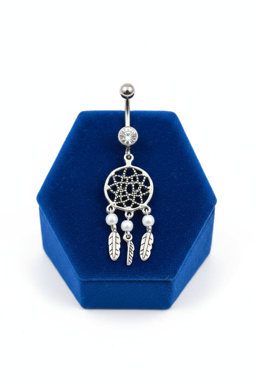 Clear Crystal Dream Catcher Belly Button Ring in 316l stainless steel on a blue velvet jewelry display.