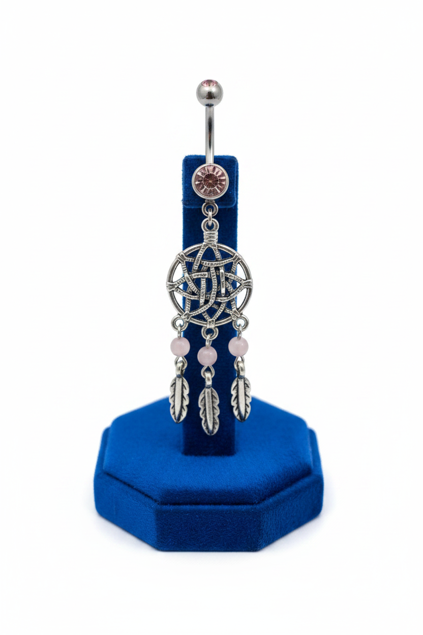 Pink Crystal Dream Catcher Belly Button Ring in 316l stainless steel on a blue velvet jewelry display showing design detail.