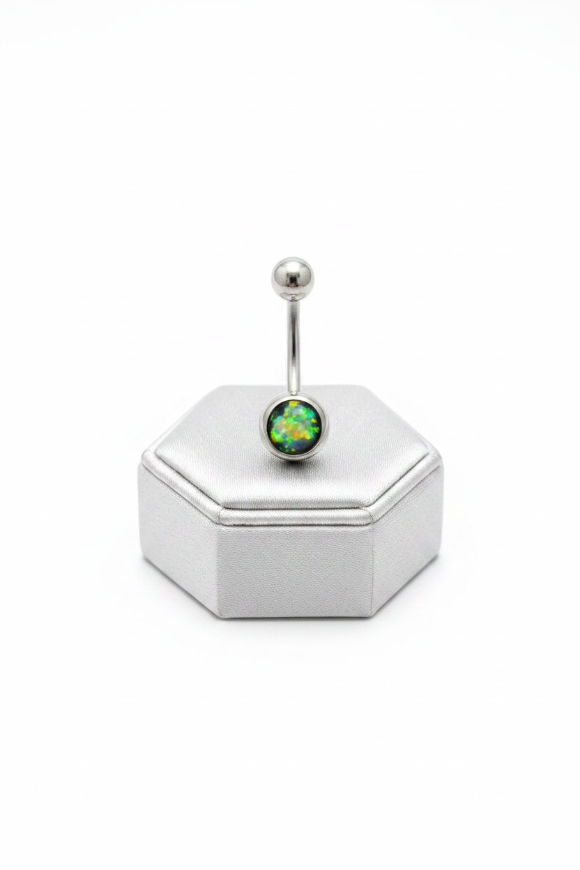 Black Opal Belly Button Ring in 316l stainless steel on a silver silk jewelry display upright position.