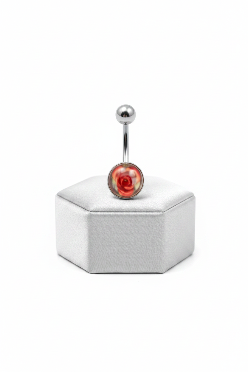 Red Rose Acrylic Belly Button Ring in 316l stainless steel on a silver jewelry display upright position.