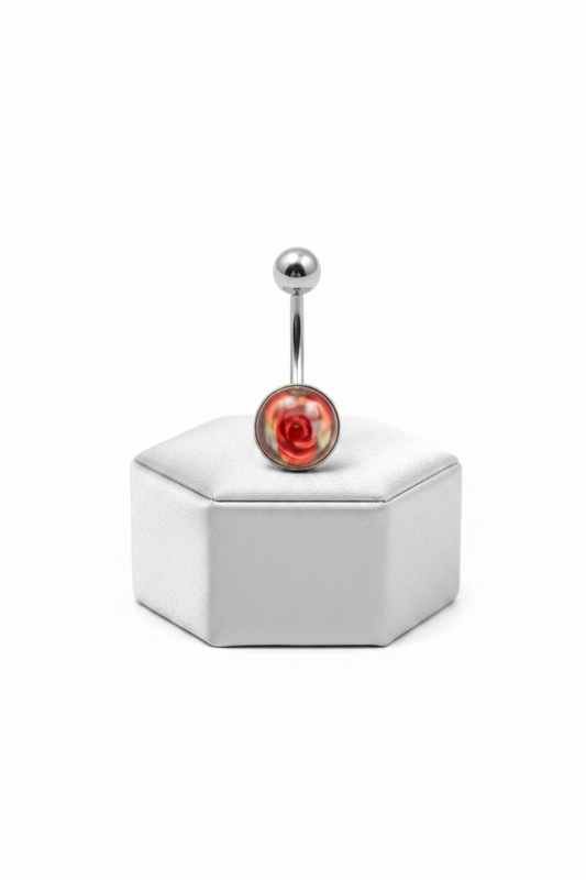 Red Rose Acrylic Belly Button Ring in 316l stainless steel on a silver jewelry display upright position.