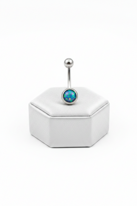 Navy Opal Belly Button Ring in 316l stainless steel on a silver silk jewelry display upright position.