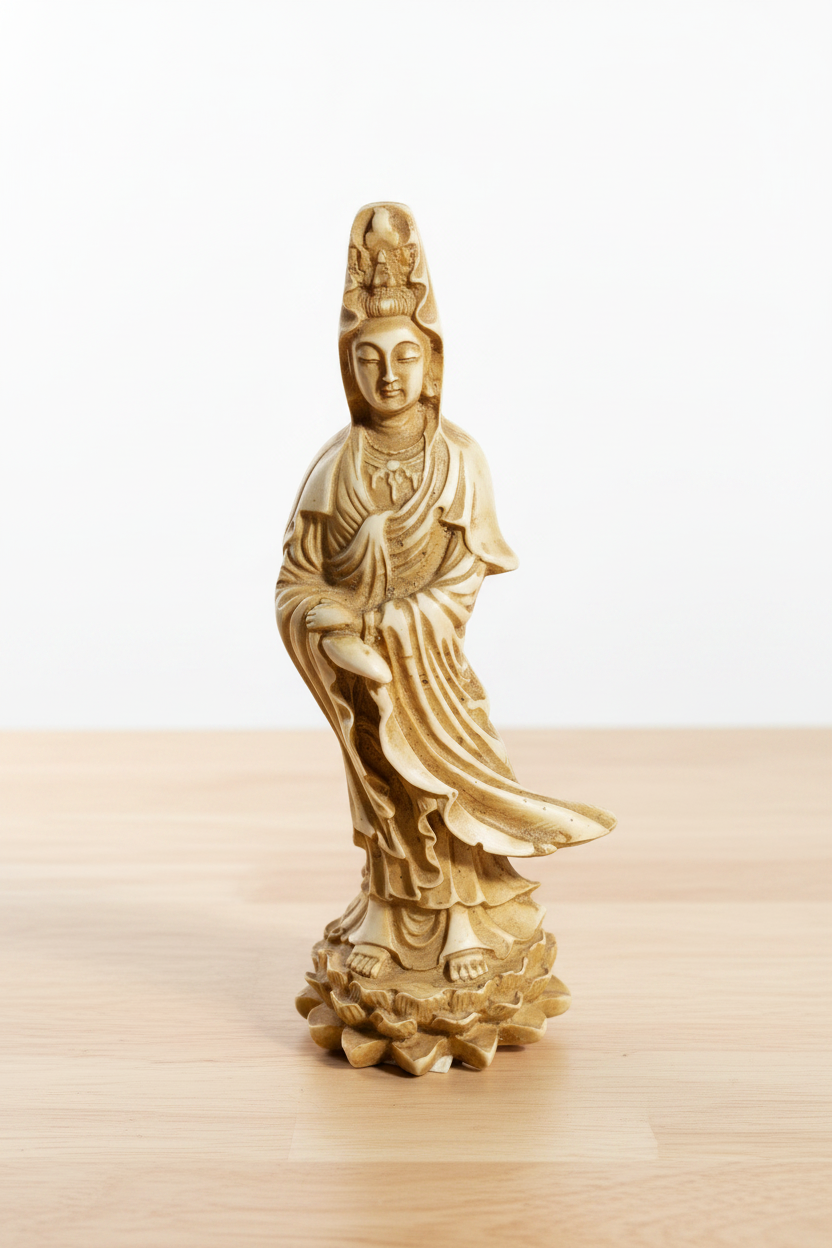 Ancient Goddess Quan Yin Ceramic Mini Figurine - Altar & Sacred Space on wooden table with a white background.