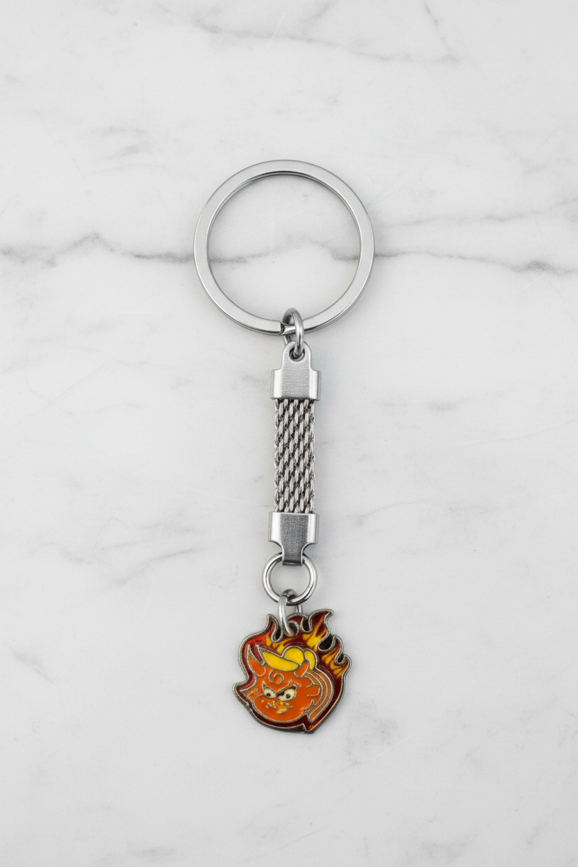 Little Red Devil Handmade Silver Plated Charm Keychain on a white marble surface.