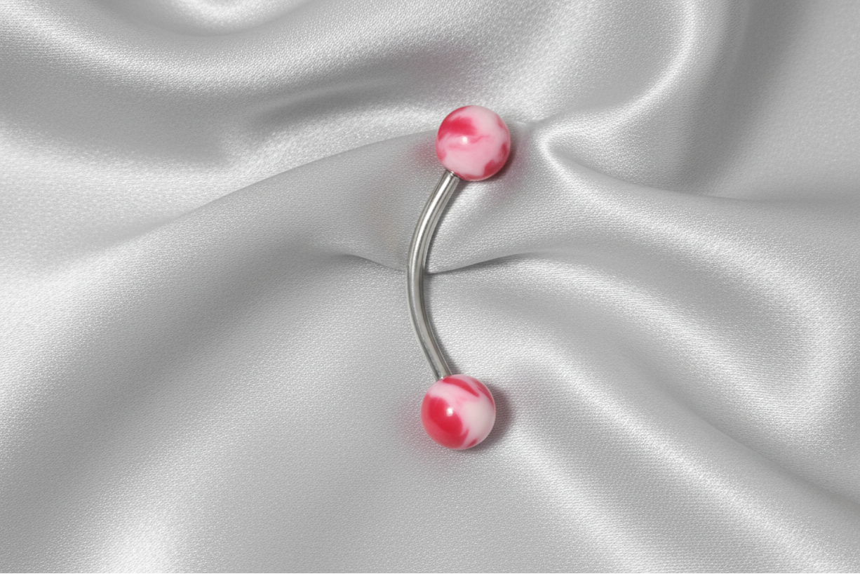 Red and White Acrylic Ball Eyebrow Ring in 316l stainless steel.