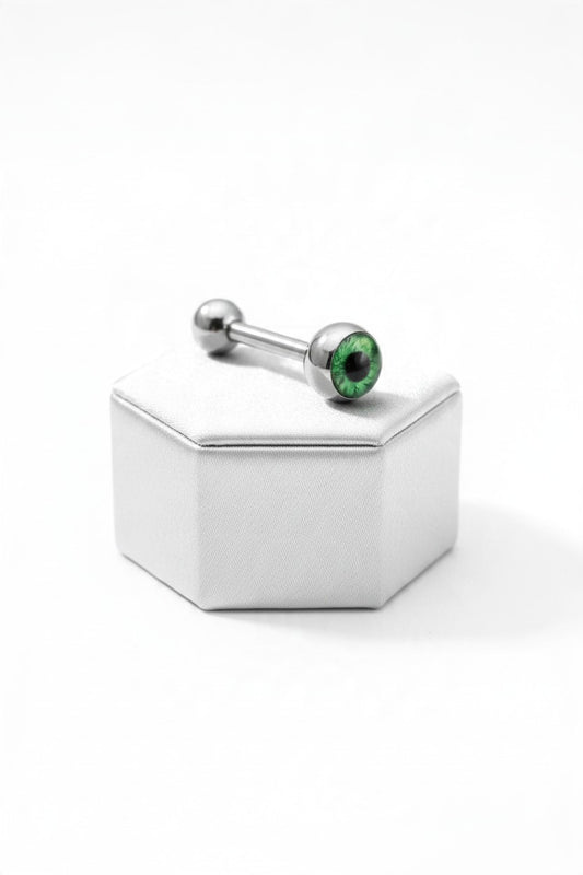 Green Eyeball Tongue Barbell in 316l stainless steel on a silver silk jewelry display.