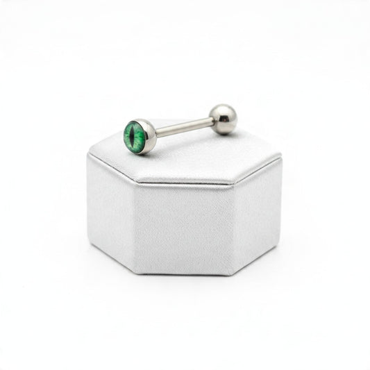 Green Snake Eye Tongue Barbell in 316l stainless steel on a silver silk jewelry display.
