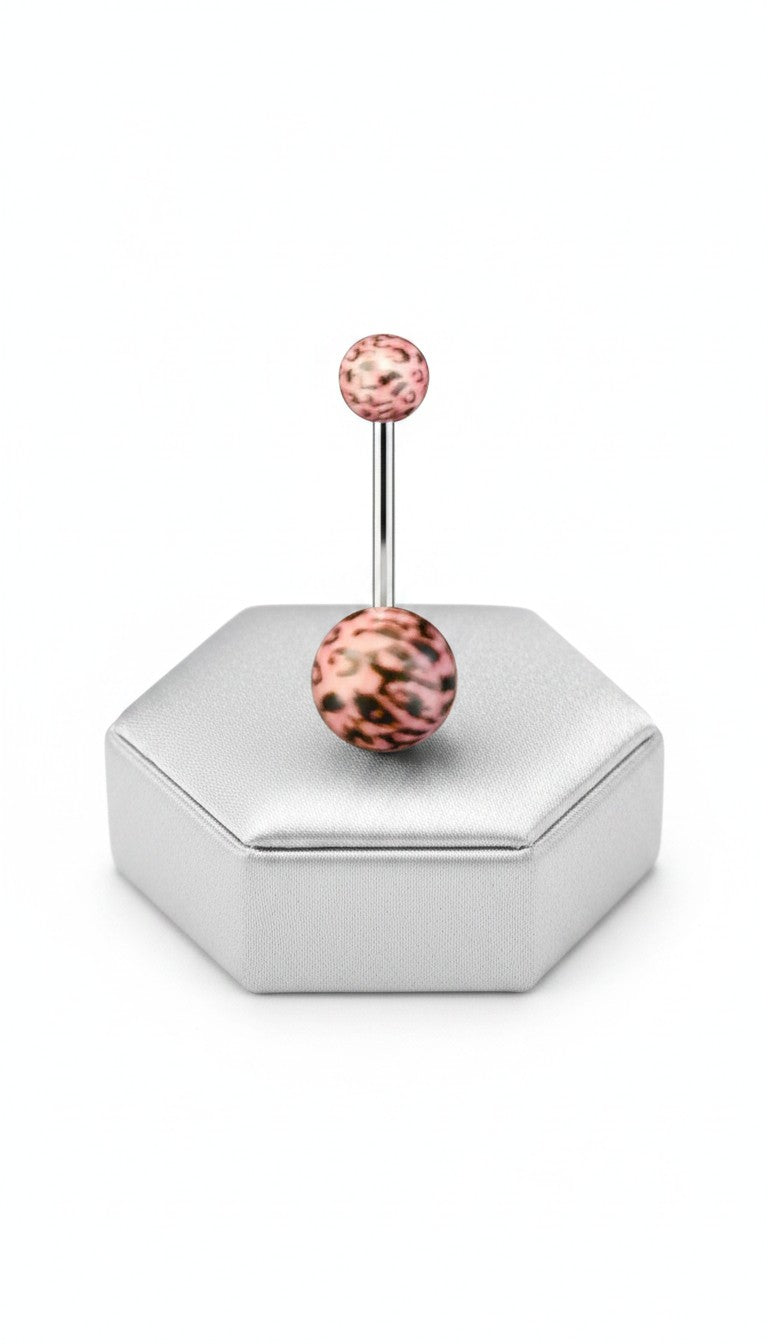 Pink Leopard Print Acrylic Belly Button Ring in 316l stainless steel on a silver jewelry display.