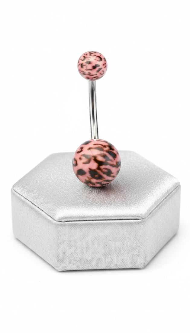 Pink Leopard Print Acrylic Belly Button Ring in 316l stainless steel on a silver jewelry display in close up detail.