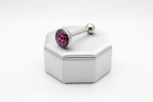 Purple Leopard Print Tongue Barbell in 316l stainless steel on a silver silk jewelry display.