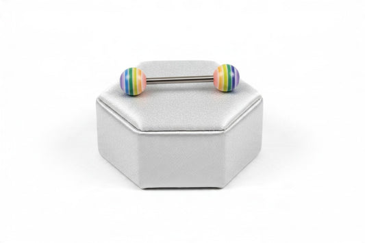 Rainbow Acrylic Tongue Barbell in 316l stainless steel on a silver silk jewelry display.