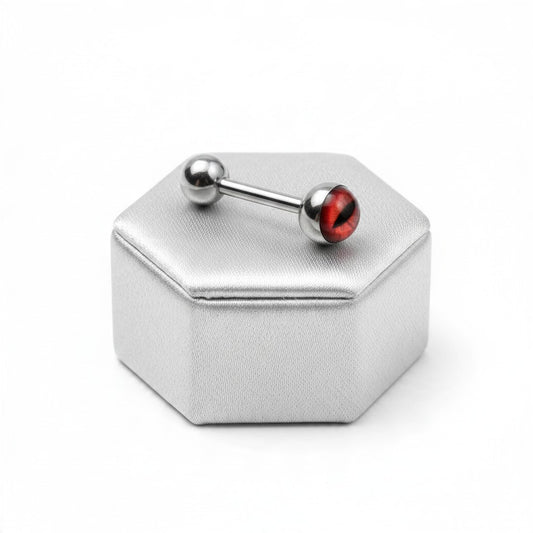 Red Snake Eye Tongue Barbell in 316l stainless steel on a silver silk jewelry display.