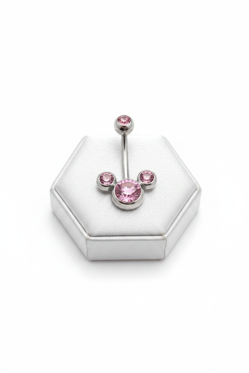 Pink Crystal Belly Button Ring in 316l stainless steel on a silver jewelry display front facing.