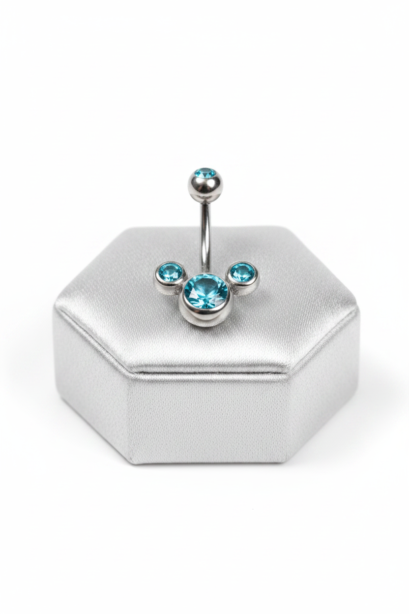 Aqua Crystal Belly Button Ring in 316l stainless steel on a silver jewelry display upright angle.
