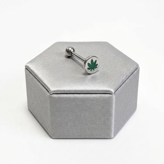 Steel Green Leaf Tongue Barbell in 316l stainless steel on a silver silk jewelry display.