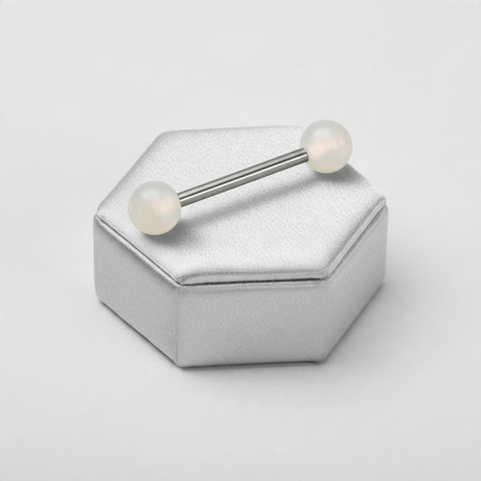 White Glow in the Dark Acrylic Tongue Barbell in 316l stainless steel on a silver silk jewelry display.